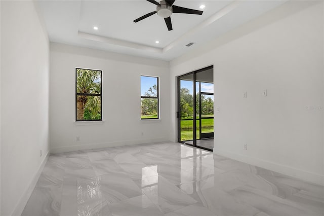 17200 Mint Ln, Punta Gorda, FL 33955 - unfurnished room with ceiling fan, recessed lighting, light marble finish flooring, and a raised ceiling