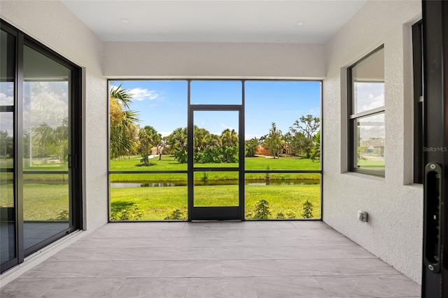 17200 Mint Ln, Punta Gorda, FL 33955 - unfurnished sunroom featuring a water view
