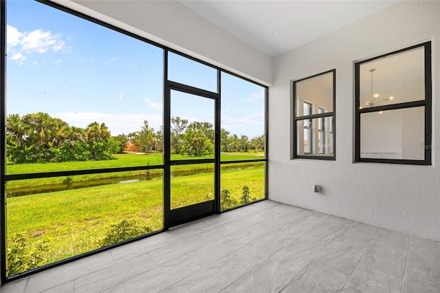 17200 Mint Ln, Punta Gorda, FL 33955 - unfurnished sunroom featuring a water view and view of wooded area