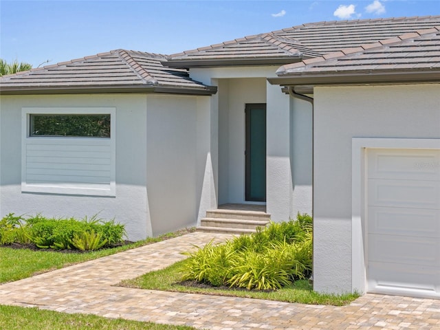 16506 Cape Horn Blvd, Punta Gorda, FL 33955 - doorway to property with stucco siding and a tile roof