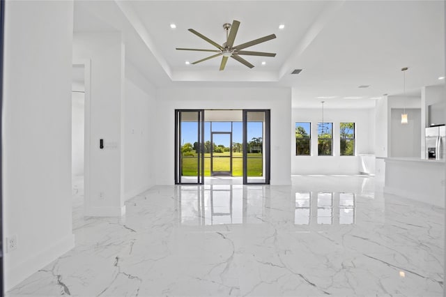 16506 Cape Horn Blvd, Punta Gorda, FL 33955 - unfurnished room with a tray ceiling, recessed lighting, ceiling fan, and light marble finish flooring