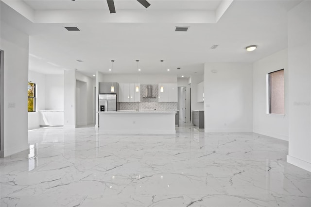 16506 Cape Horn Blvd, Punta Gorda, FL 33955 - unfurnished living room featuring plenty of natural light, a ceiling fan, and light marble finish flooring