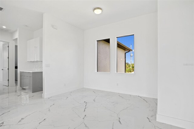 16506 Cape Horn Blvd, Punta Gorda, FL 33955 - spare room with light marble finish flooring and baseboards