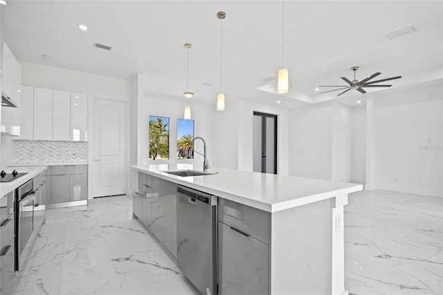 16506 Cape Horn Blvd, Punta Gorda, FL 33955 - kitchen featuring modern cabinets, appliances with stainless steel finishes, light marble finish floors, decorative backsplash, and recessed lighting