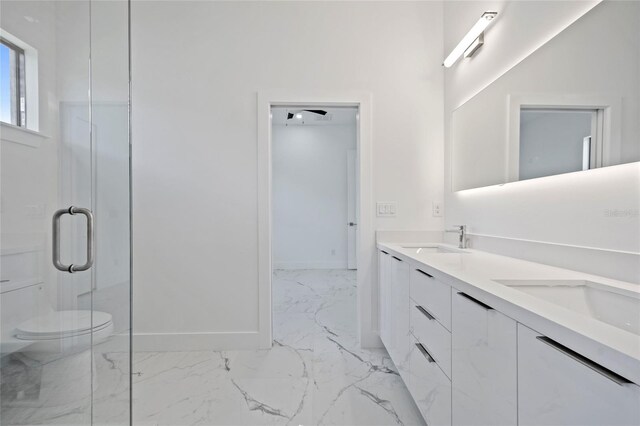 16506 Cape Horn Blvd, Punta Gorda, FL 33955 - bathroom featuring marble look tile flooring, double vanity, and an enclosed shower