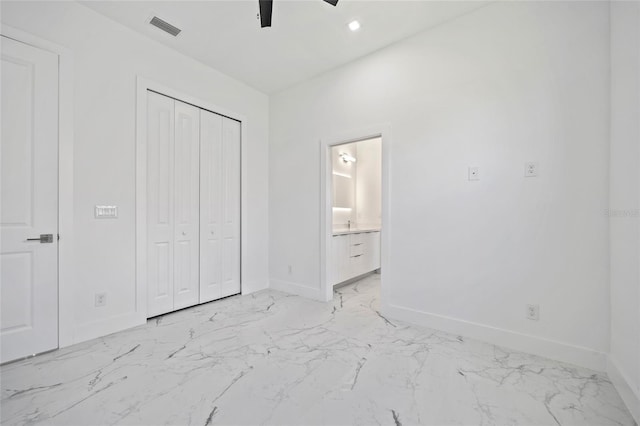 16506 Cape Horn Blvd, Punta Gorda, FL 33955 - unfurnished bedroom with light marble finish flooring, a closet, ceiling fan, ensuite bath, and recessed lighting