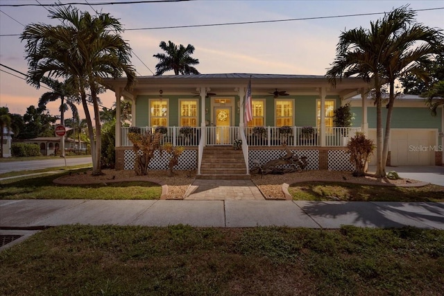 233 Durrance St, Punta Gorda, FL 33950 - ranch-style house featuring a porch, an attached garage, a ceiling fan, and stairway
