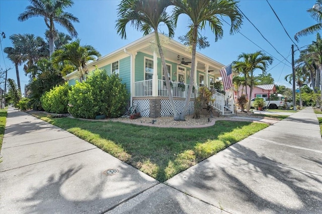 233 Durrance St, Punta Gorda, FL 33950 - view of front of property featuring a porch, a ceiling fan, and a front yard