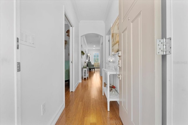 233 Durrance St, Punta Gorda, FL 33950 - hallway with arched walkways, crown molding, and light wood-style flooring