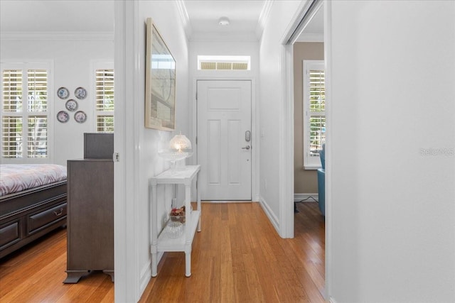 233 Durrance St, Punta Gorda, FL 33950 - entryway with light wood-style flooring and crown molding