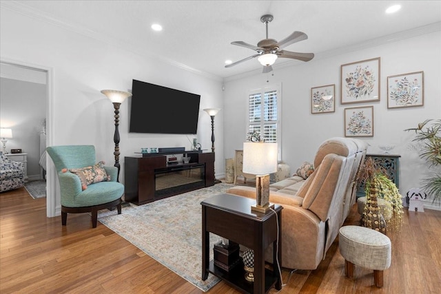 233 Durrance St, Punta Gorda, FL 33950 - living room featuring ceiling fan, light wood-type flooring, crown molding, and recessed lighting