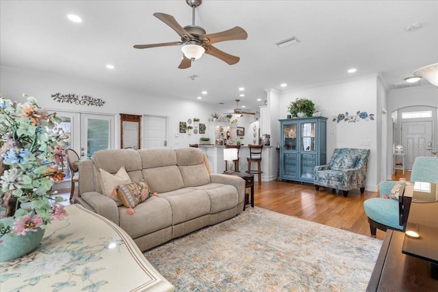 233 Durrance St, Punta Gorda, FL 33950 - living room with a ceiling fan, ornamental molding, french doors, wood finished floors, and recessed lighting