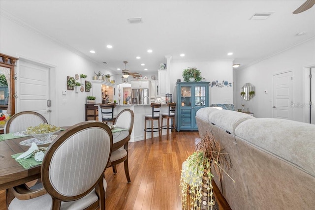 233 Durrance St, Punta Gorda, FL 33950 - dining area with ceiling fan, crown molding, light wood-style floors, and recessed lighting