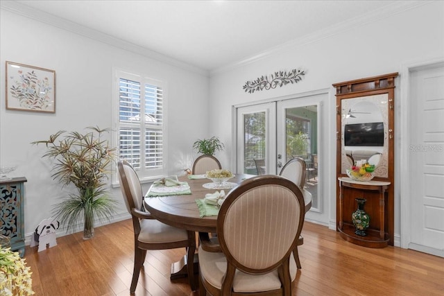 233 Durrance St, Punta Gorda, FL 33950 - dining area featuring light wood-style floors, crown molding, and french doors