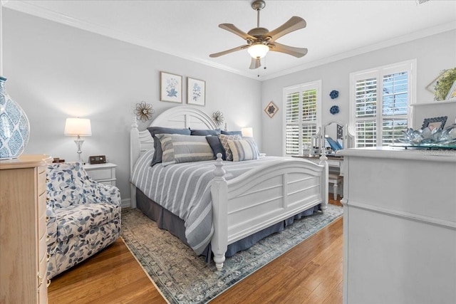 233 Durrance St, Punta Gorda, FL 33950 - bedroom with wood finished floors, ornamental molding, and ceiling fan
