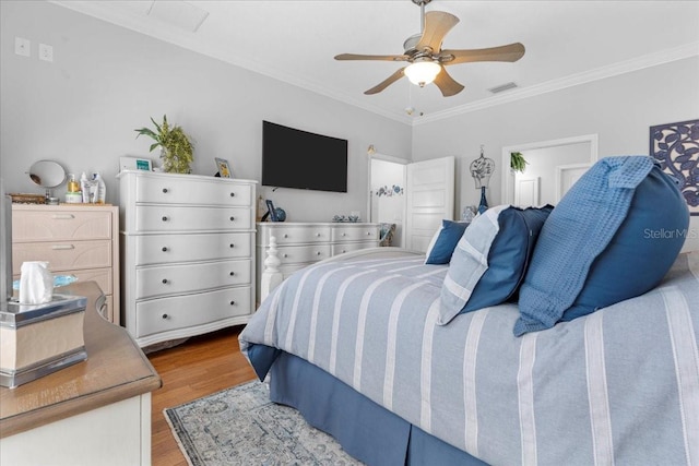 233 Durrance St, Punta Gorda, FL 33950 - bedroom with wood finished floors, ornamental molding, and a ceiling fan