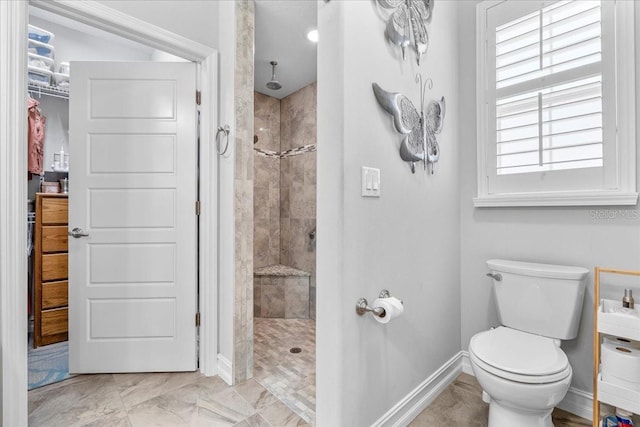233 Durrance St, Punta Gorda, FL 33950 - bathroom featuring a tile shower and baseboards