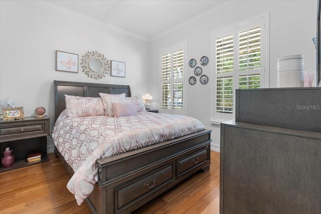 233 Durrance St, Punta Gorda, FL 33950 - bedroom featuring wood finished floors and crown molding