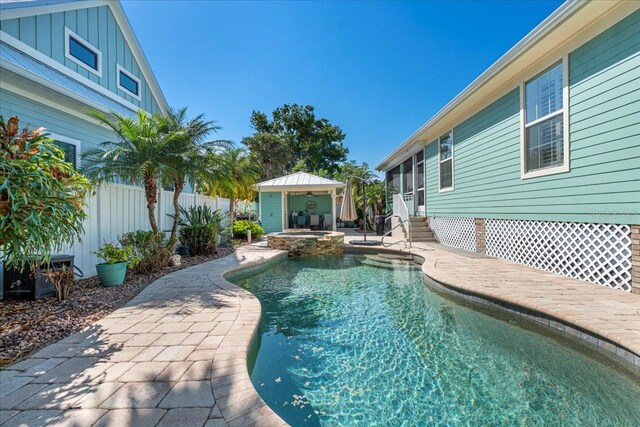 233 Durrance St, Punta Gorda, FL 33950 - view of pool with entry steps, a patio, and a pool with connected hot tub