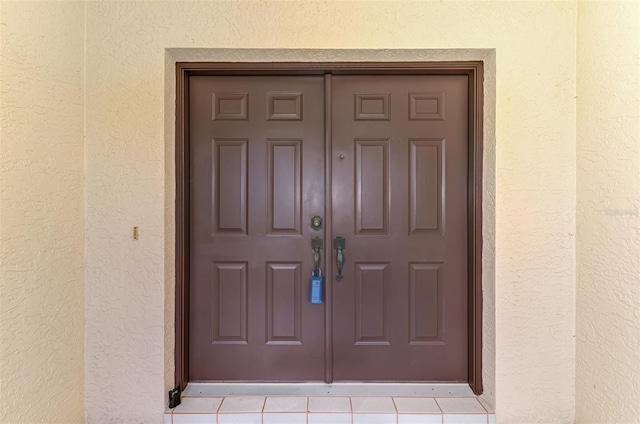 510 Border St, Port Charlotte, FL 33953 - view of exterior entry with stucco siding