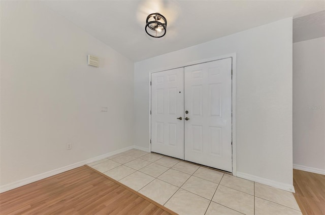 510 Border St, Port Charlotte, FL 33953 - foyer entrance featuring light wood-type flooring and baseboards