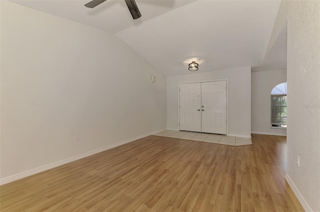 510 Border St, Port Charlotte, FL 33953 - foyer entrance with light wood-style flooring, vaulted ceiling, and ceiling fan