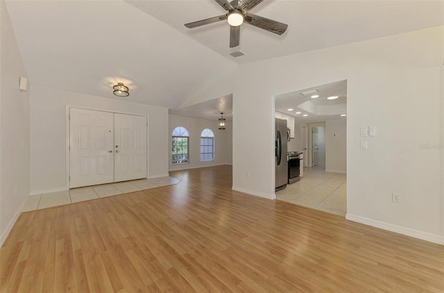 510 Border St, Port Charlotte, FL 33953 - entryway with light wood-style flooring, ceiling fan, and vaulted ceiling