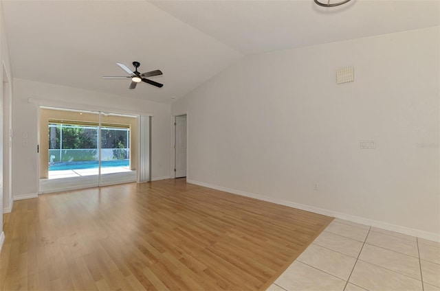 510 Border St, Port Charlotte, FL 33953 - empty room with ceiling fan, lofted ceiling, and light wood-style flooring