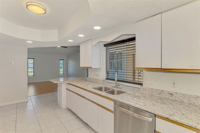510 Border St, Port Charlotte, FL 33953 - kitchen featuring dishwasher, recessed lighting, white cabinets, light tile patterned floors, and light stone countertops