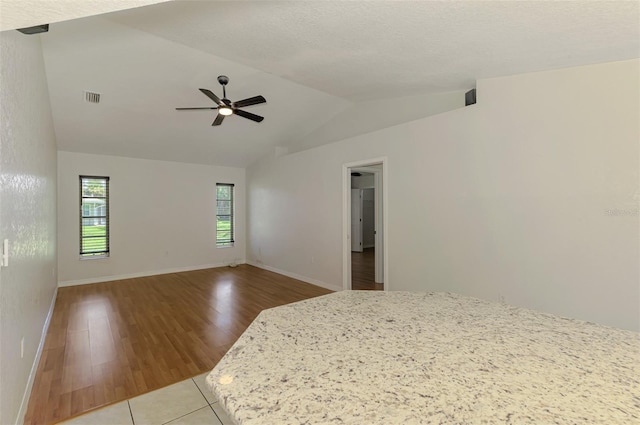 510 Border St, Port Charlotte, FL 33953 - unfurnished room featuring lofted ceiling, ceiling fan, and wood finished floors