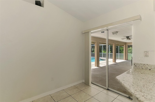 510 Border St, Port Charlotte, FL 33953 - empty room featuring light tile patterned floors and a ceiling fan