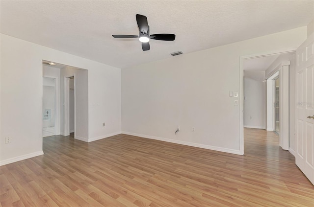 510 Border St, Port Charlotte, FL 33953 - unfurnished room featuring a ceiling fan, light wood finished floors, and a textured ceiling