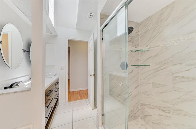 510 Border St, Port Charlotte, FL 33953 - bathroom featuring a shower stall, vanity, and tile patterned floors