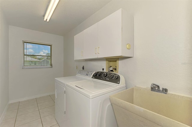 510 Border St, Port Charlotte, FL 33953 - laundry room with washing machine and clothes dryer, cabinet space, and light tile patterned floors