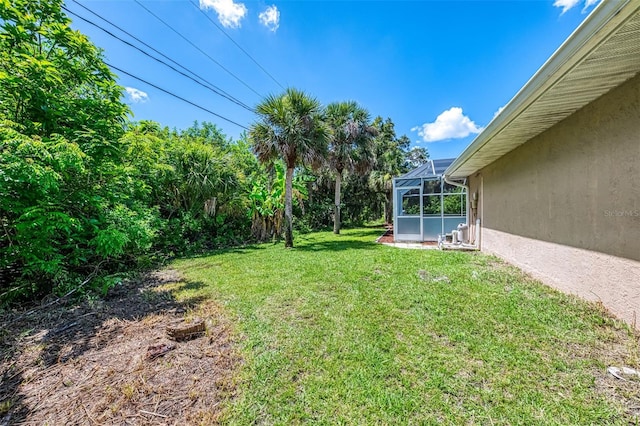 510 Border St, Port Charlotte, FL 33953 - view of grassy yard featuring a lanai