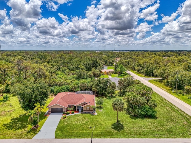 510 Border St, Port Charlotte, FL 33953 - aerial view of property and surrounding area with a heavily wooded area