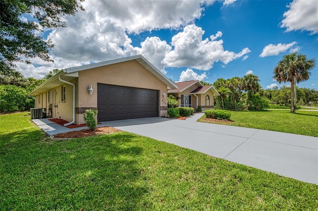 510 Border St, Port Charlotte, FL 33953 - ranch-style home featuring stucco siding, a garage, driveway, and a front lawn