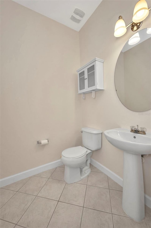 200 Valdiva St, Punta Gorda, FL 33983 - half bathroom featuring toilet and tile patterned floors
