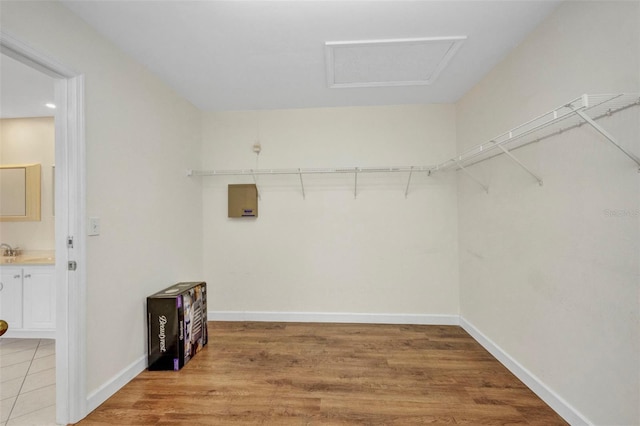 200 Valdiva St, Punta Gorda, FL 33983 - walk in closet featuring wood finished floors and attic access