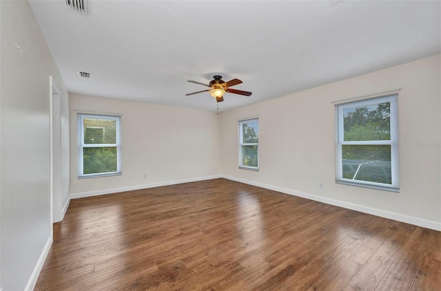 200 Valdiva St, Punta Gorda, FL 33983 - empty room featuring healthy amount of natural light, dark wood-type flooring, and a ceiling fan