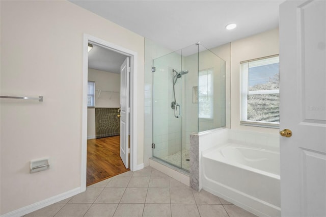 200 Valdiva St, Punta Gorda, FL 33983 - full bathroom with a shower stall, a garden tub, tile patterned flooring, and a spacious closet