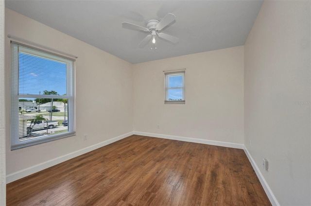 200 Valdiva St, Punta Gorda, FL 33983 - empty room featuring plenty of natural light, wood finished floors, and a ceiling fan