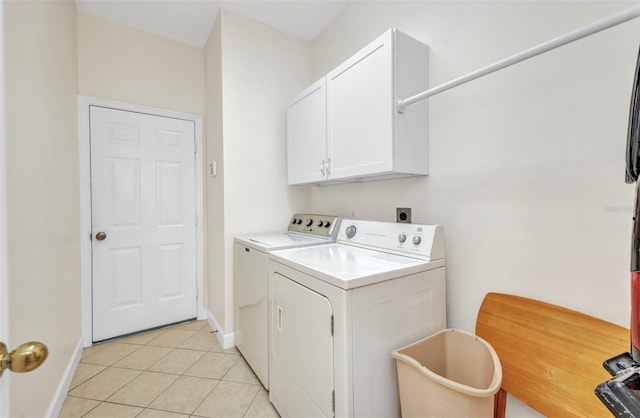 200 Valdiva St, Punta Gorda, FL 33983 - washroom with washer and dryer, cabinet space, and light tile patterned floors