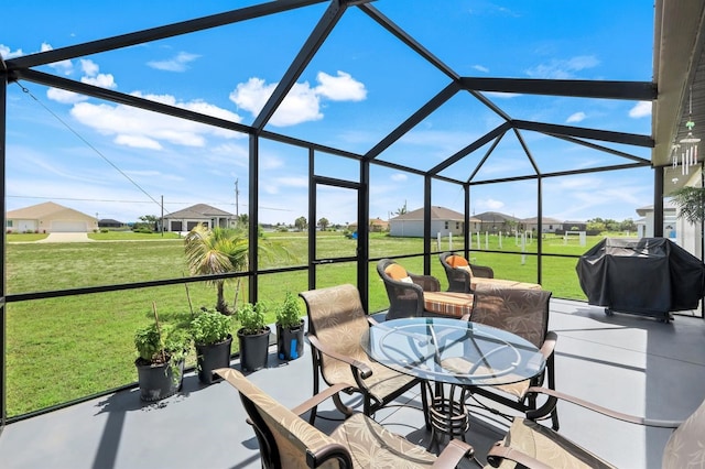 4321 NW 34th Ln, Cape Coral, FL 33993 - view of patio with a grill, glass enclosure, outdoor dining space, and a residential view