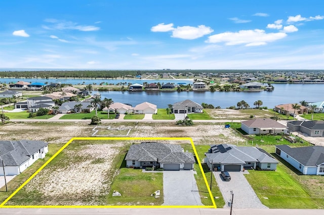 4321 NW 34th Ln, Cape Coral, FL 33993 - aerial perspective of suburban area featuring property parcel outlined and a nearby body of water