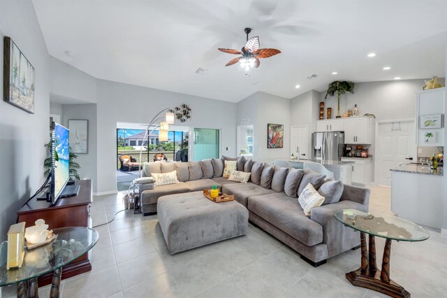 4321 NW 34th Ln, Cape Coral, FL 33993 - living room featuring high vaulted ceiling, a ceiling fan, light tile patterned floors, and recessed lighting
