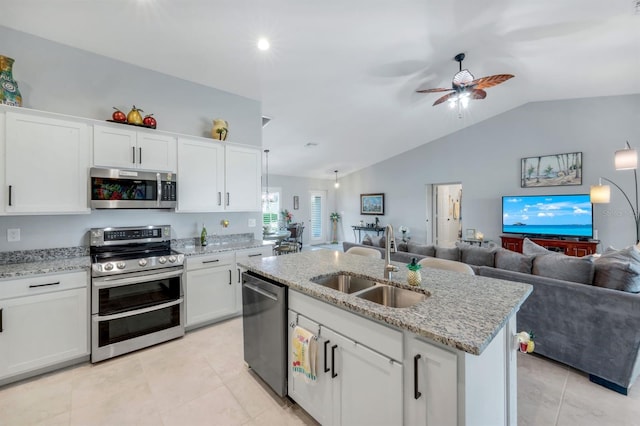 4321 NW 34th Ln, Cape Coral, FL 33993 - kitchen with stainless steel appliances, open floor plan, ceiling fan, lofted ceiling, and light tile patterned floors