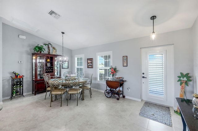 4321 NW 34th Ln, Cape Coral, FL 33993 - dining space with healthy amount of natural light, vaulted ceiling, and light tile patterned floors