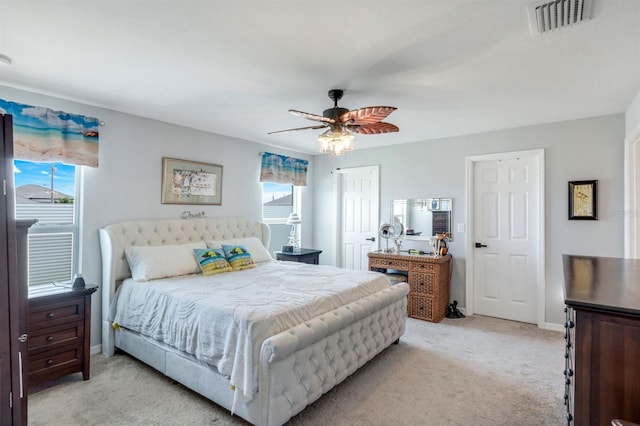 4321 NW 34th Ln, Cape Coral, FL 33993 - bedroom with light carpet, a ceiling fan, and a closet