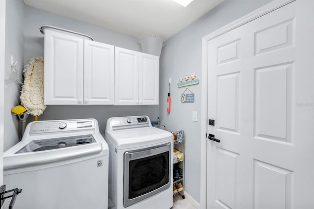 4321 NW 34th Ln, Cape Coral, FL 33993 - laundry area featuring washer and dryer and cabinet space